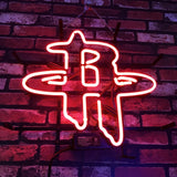 Bright red neon sign in the shape of the Houston Rockets logo mounted on a dark red and purple brick wall.