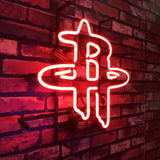 Red neon sign shaped like the intertwined letters R and H mounted on a dark red brick wall, casting a warm glow on the bricks.