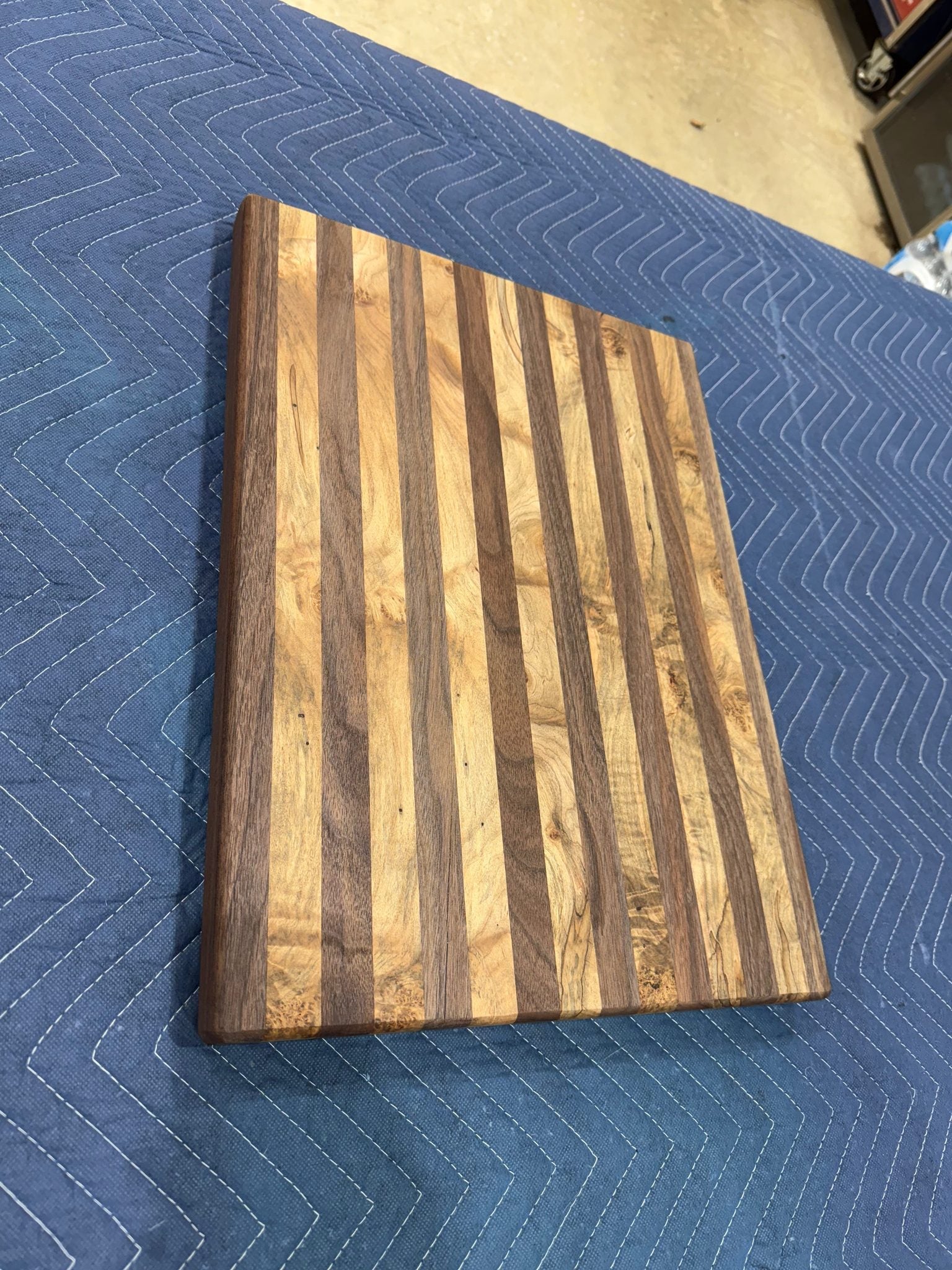 Maple and walnut cutting board with natural wood grain