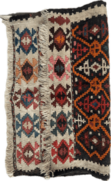 Antique Shahsavan Caucasian bagface with geometric patterns in red, blue, orange, and cream bands separated by fringe, showing worn texture and tribal design.