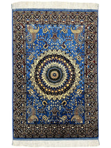 Hand-knotted Parak rug in sky blue with geometric patterns displayed on a wooden floor