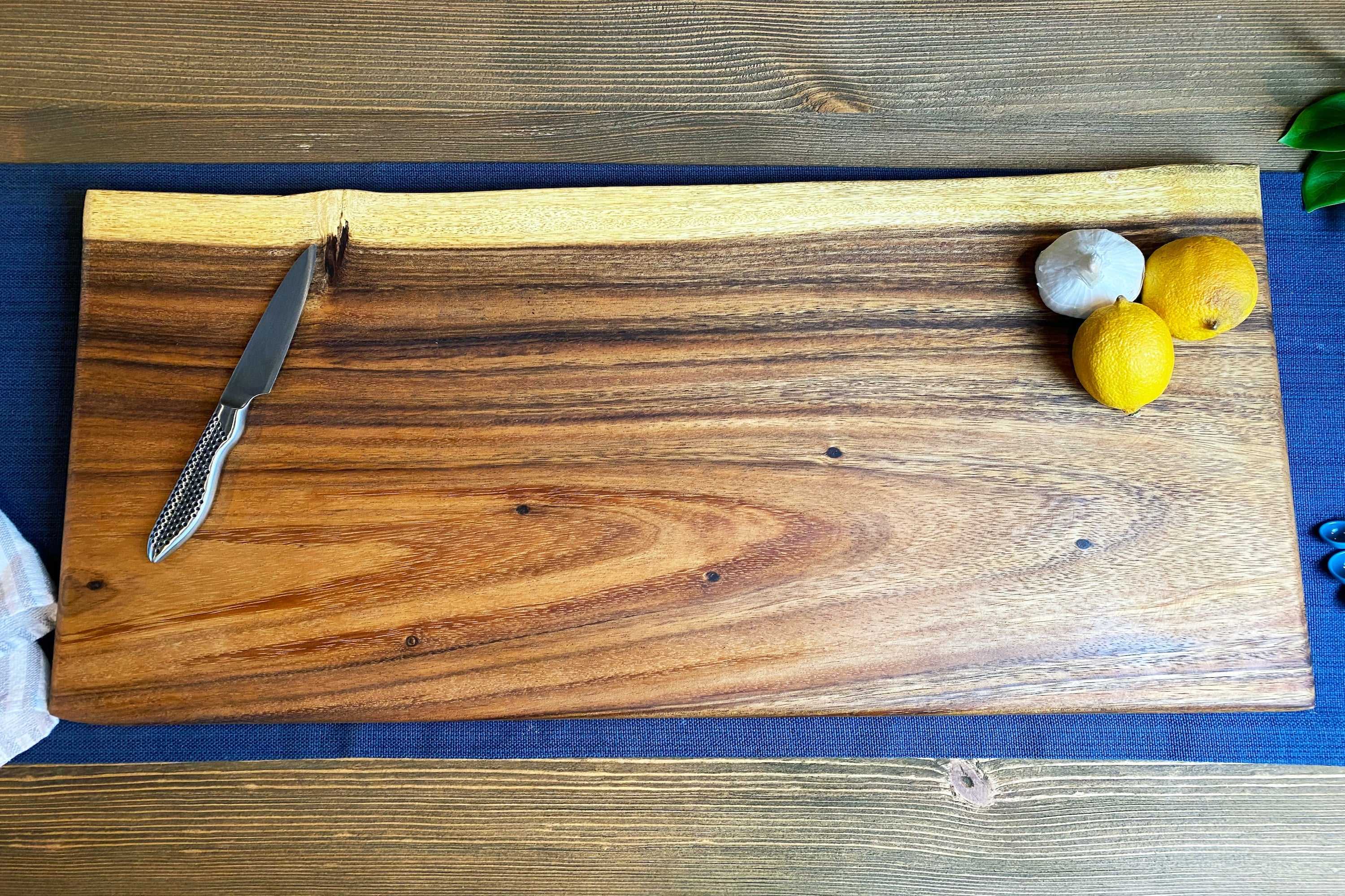 Extra Large Live Edge Square End Board crafted from East Indian Walnut showing the natural grain and one live edge