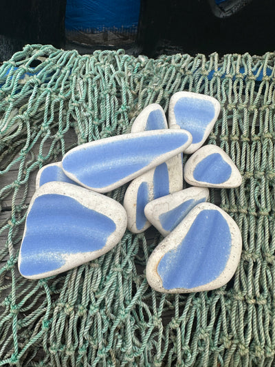 Assorted hand-tumbled pottery pieces in earthy colors for mosaic crafts