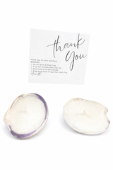 Two quahog candles with natural coastal design by MARIS LLC