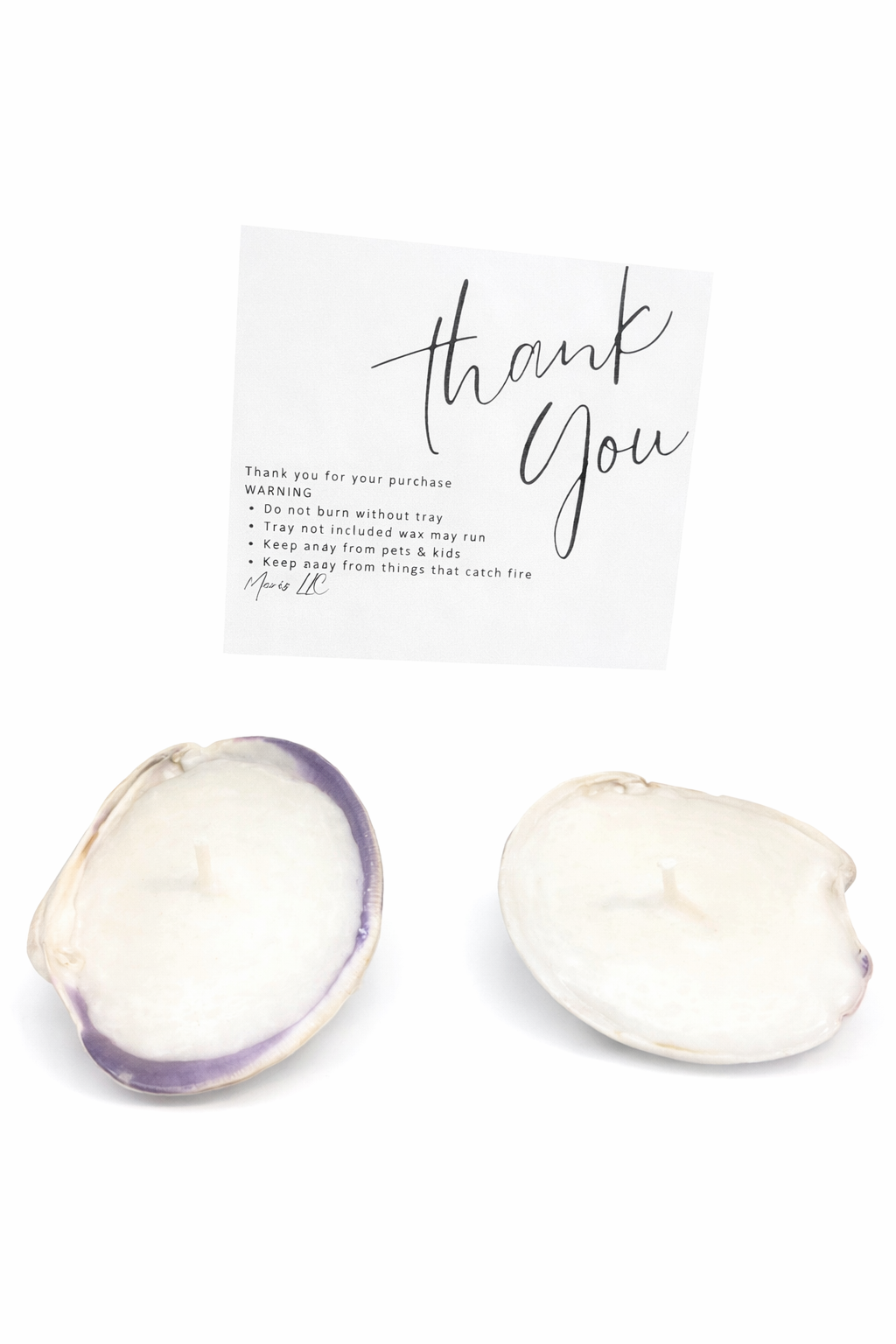 Two quahog candles with natural coastal design by MARIS LLC