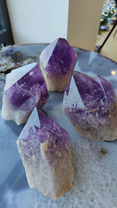Large Amethyst Point mineral specimen from Bolivia with purple crystal formations