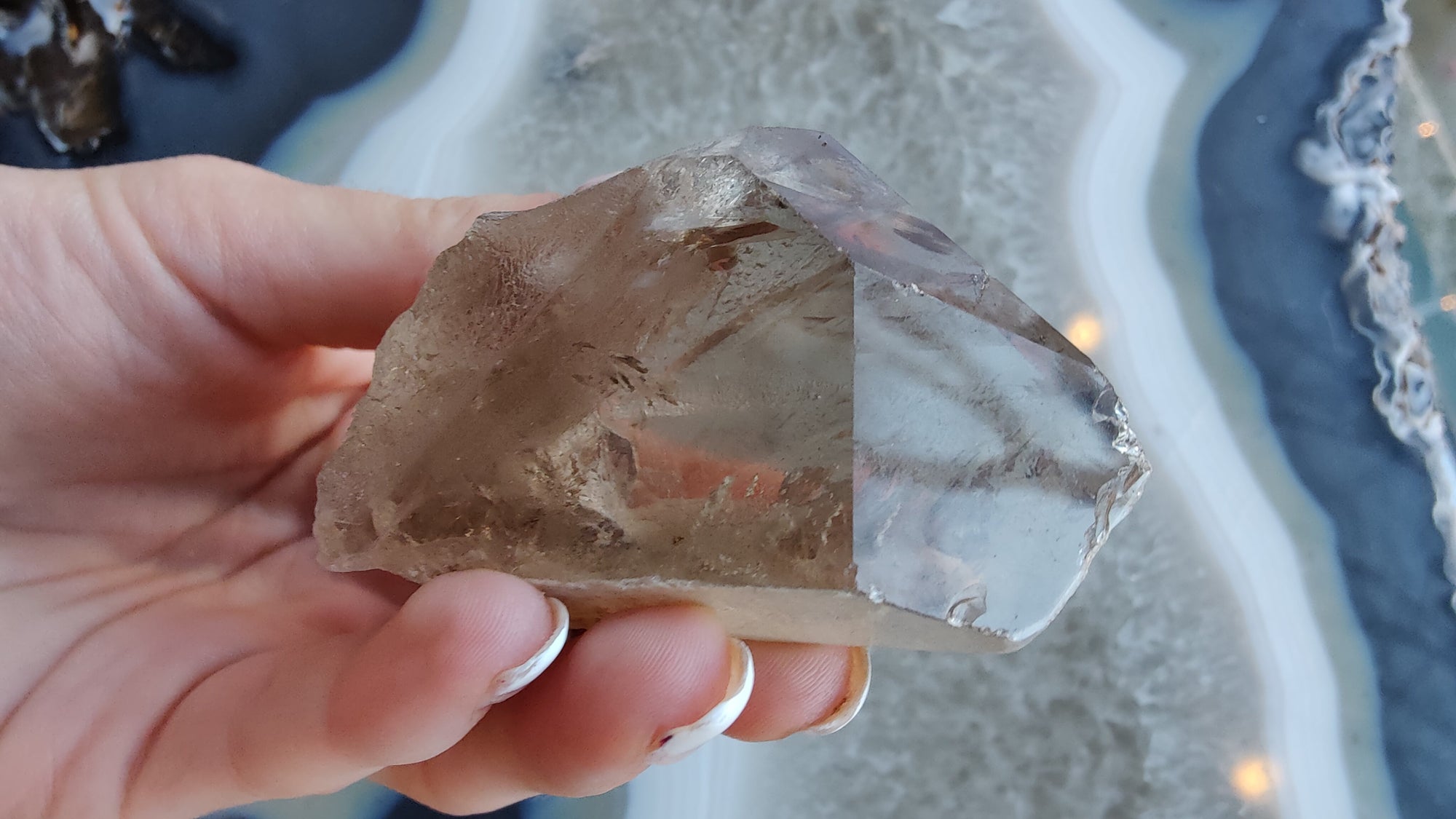 Lodalite included smoky quartz mineral specimen showing phantoms