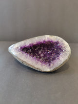 Amethyst Geode Sculpture showing polished edges and violet crystal interior