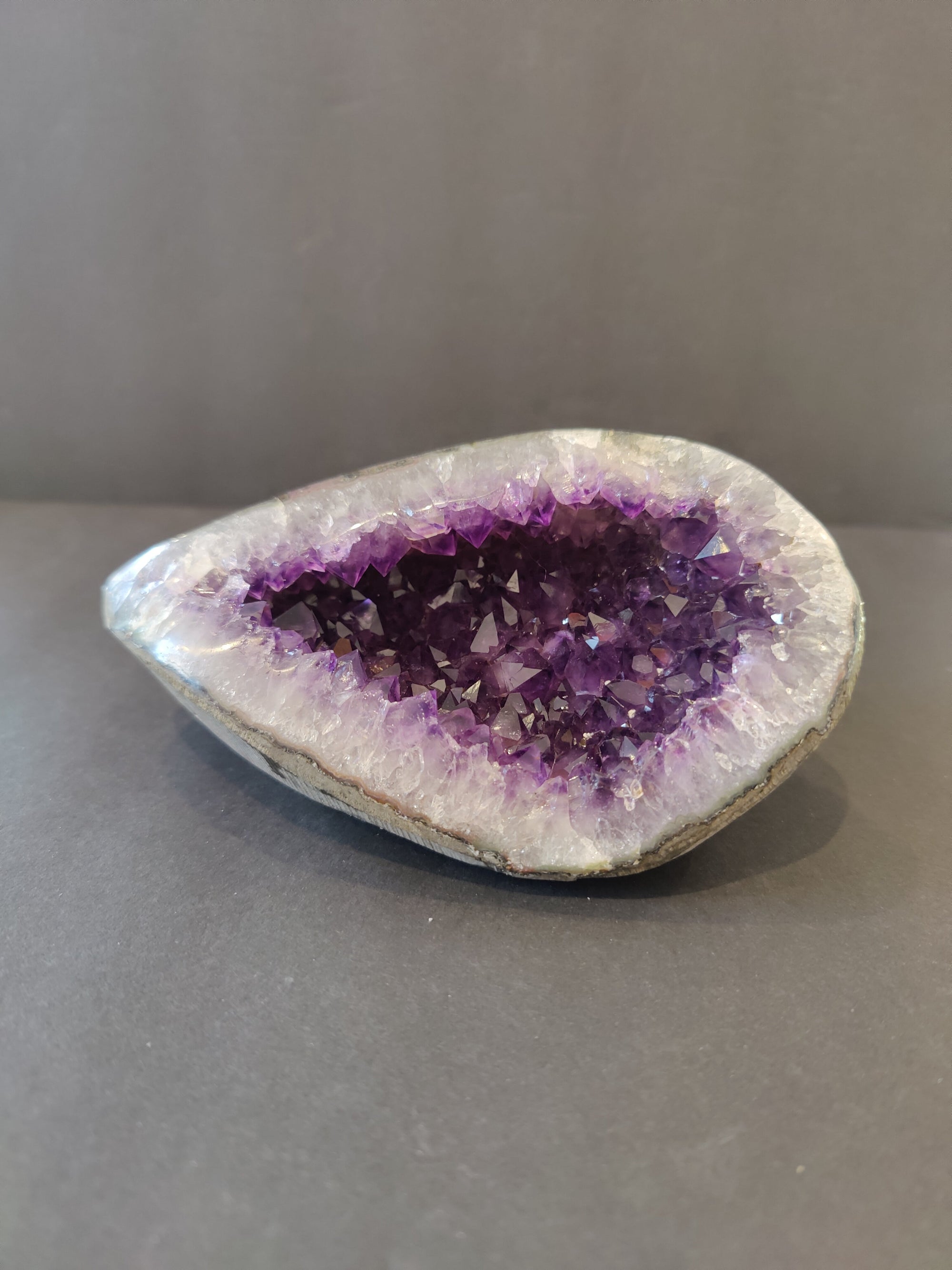 Amethyst Geode Sculpture showing polished edges and violet crystal interior