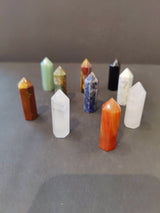 Crystal Cut Base Tower Sculpture featuring varied natural stone bases with faceted surfaces