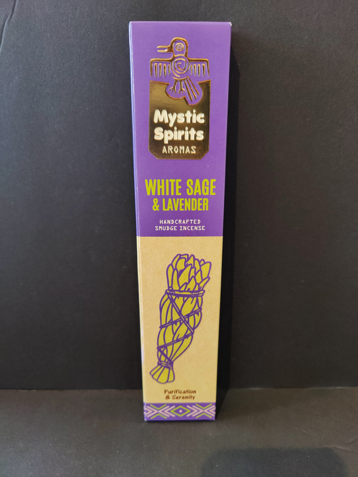 Purple and beige rectangular box of Mystic Spirits Aromas White Sage & Lavender smudge incense featuring a stylized bird emblem and a bundle of sage illustration.