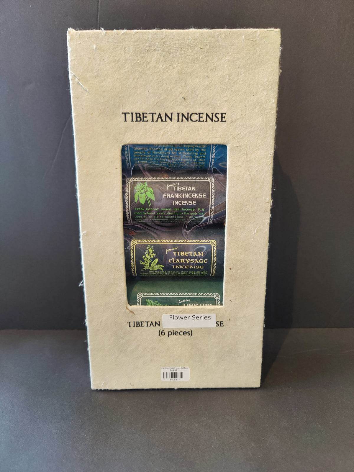 Beige textured box labeled 'Tibetan Incense' showing three colorful incense packets inside with botanical illustrations and text.