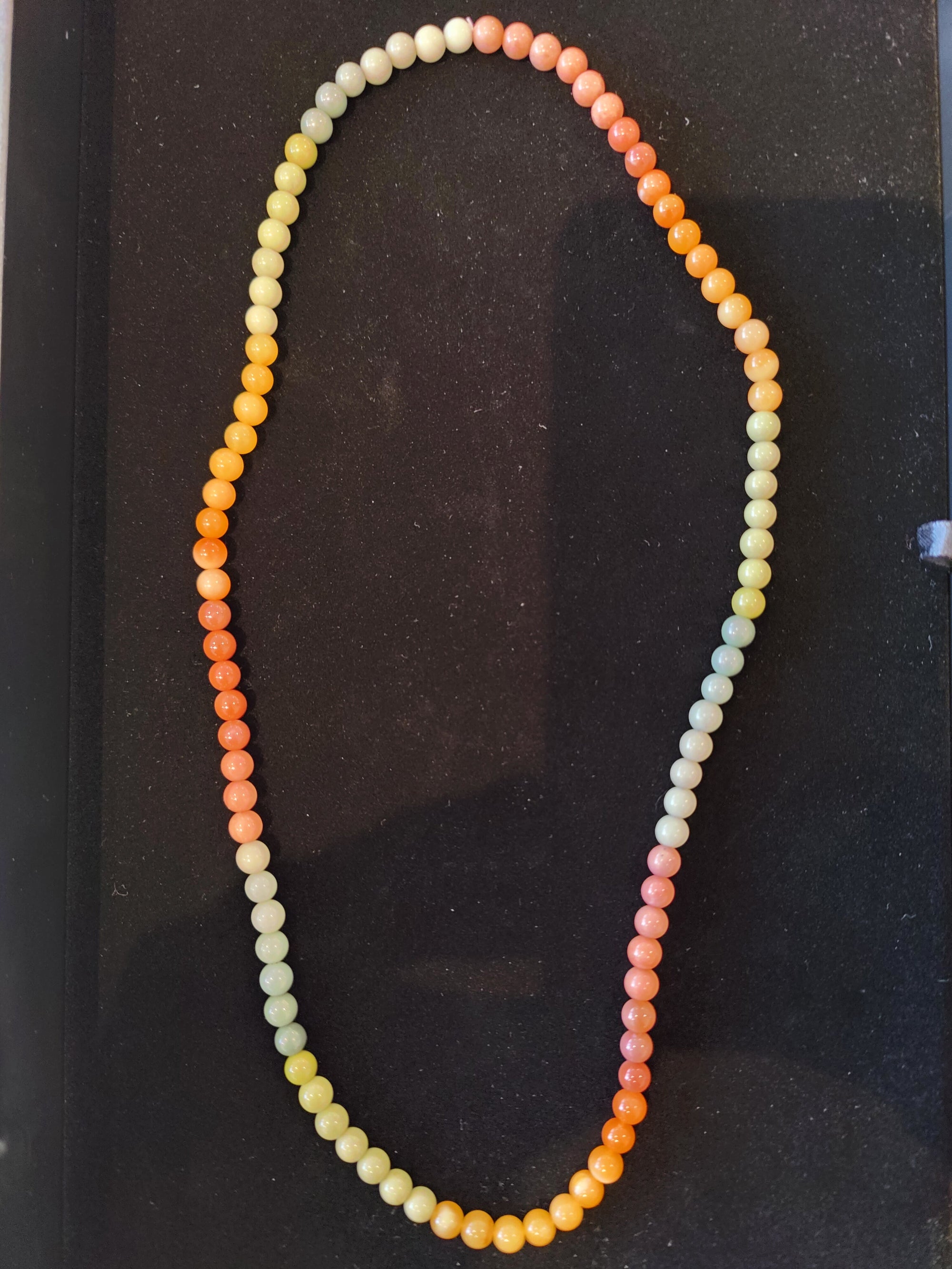 Jasper Multi-Color Round Bead Necklace 24 inches displayed on a white bust stand