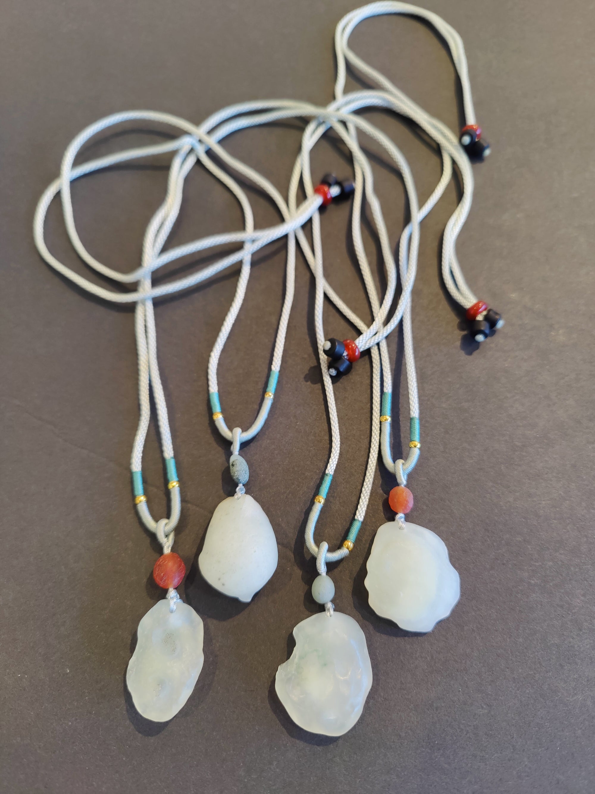 Gobi Desert green moss agate pendant displayed on an adjustable black cord necklace