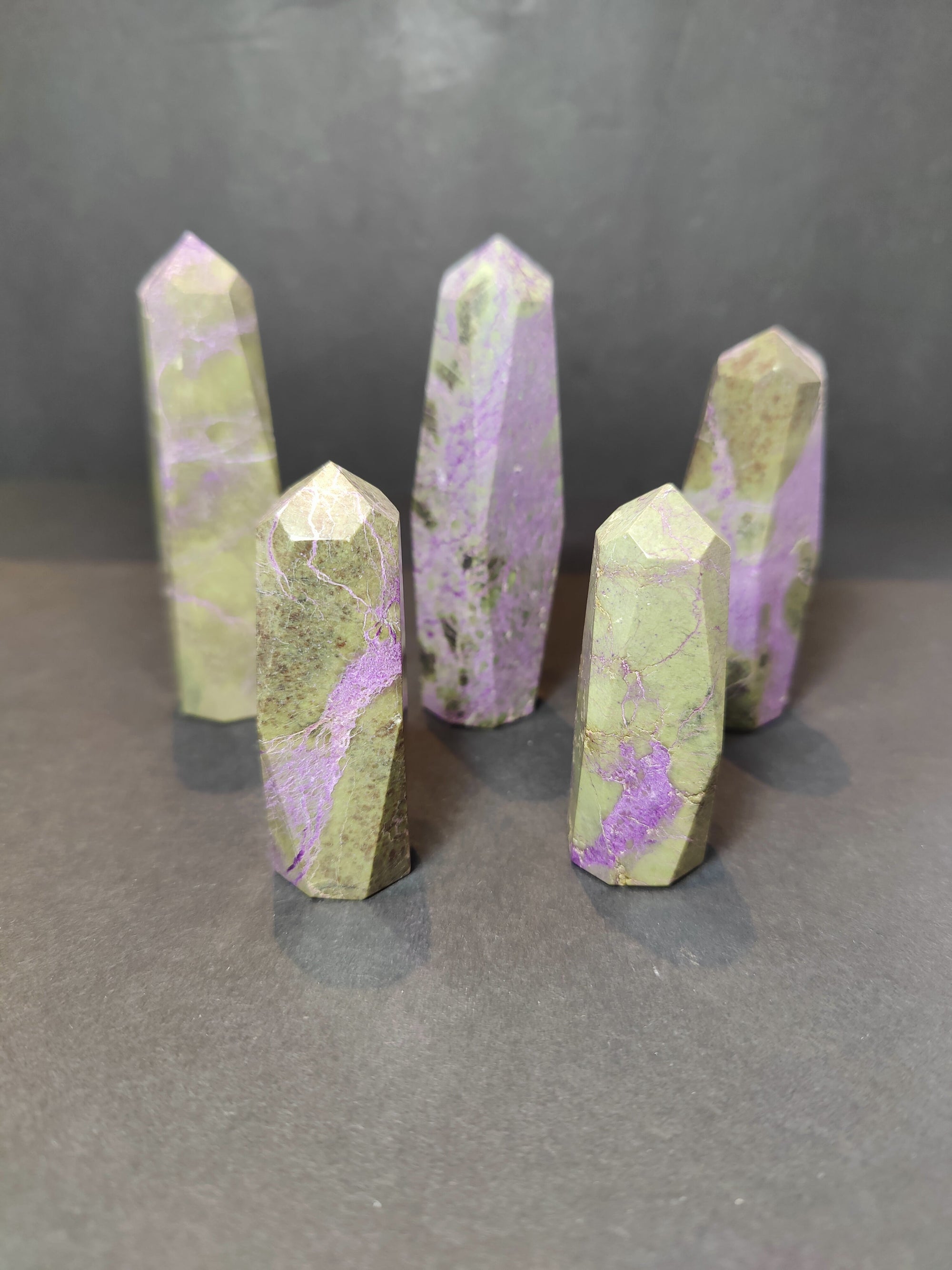 Polished Atlantisite (Stichtite with Serpentine) tower sculpture showing purple and green tones