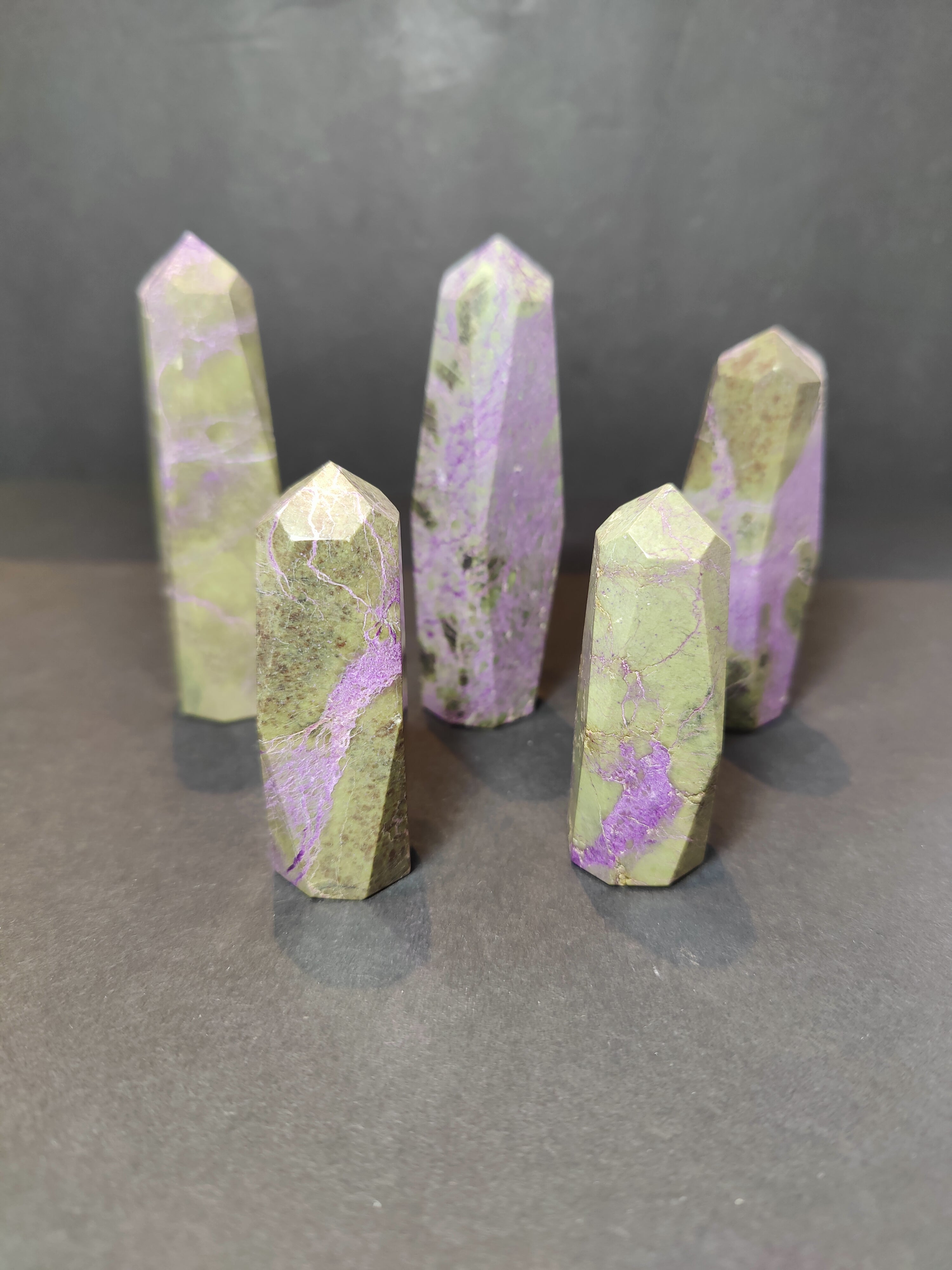 Polished Atlantisite (Stichtite with Serpentine) tower sculpture showing purple and green tones