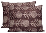 Two rectangular berry-colored pillow covers with a repeating light gray zinnia flower and leaf pattern on textured fabric.