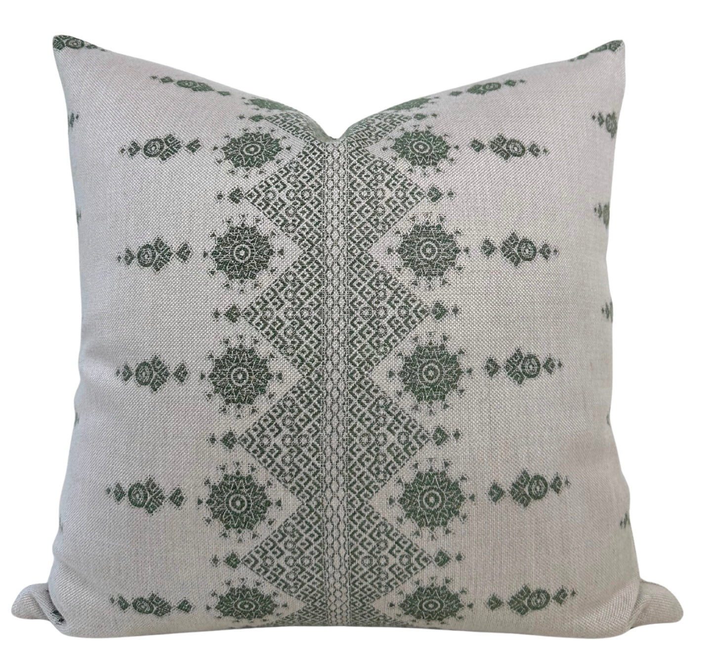 Carmania Pillow Cover in Green by DEKOWE displayed on a sofa