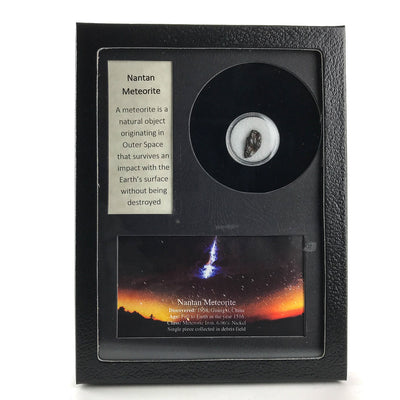 Glass display box containing a fragment of genuine Nantan meteorite with label and color image