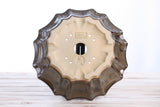 Bottom view of a 10-inch Willow Bonsai ceramic pot with a flower-shaped wavy rim in dark honey glaze and multiple drainage holes.