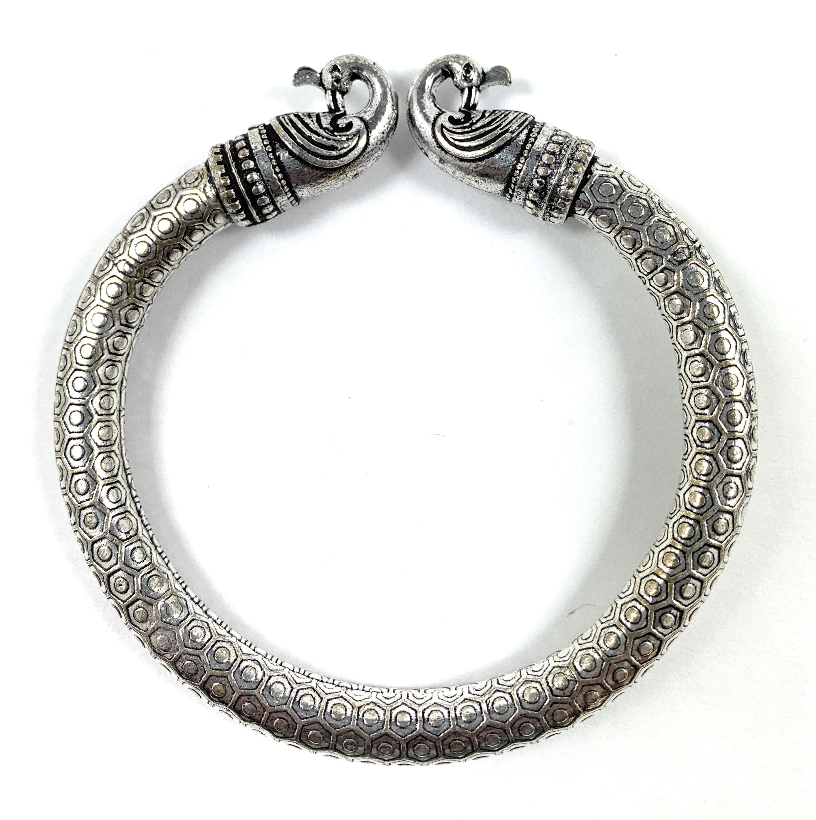 Antique Norse Peacock Head Viking Bracelet showing twisted peacock heads in vintage style