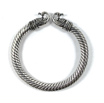 Antique Norse Peacock Head Viking Bracelet featuring two peacock heads twisted together in bronze tone, shown on a white background.