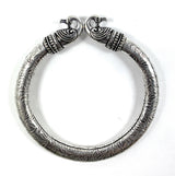 Antique Norse Peacock Head Viking Bracelet with detailed leaf pattern on a neutral background