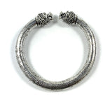 Antique Norse Lion Heads Viking Bracelet with Square Pattern on a neutral background