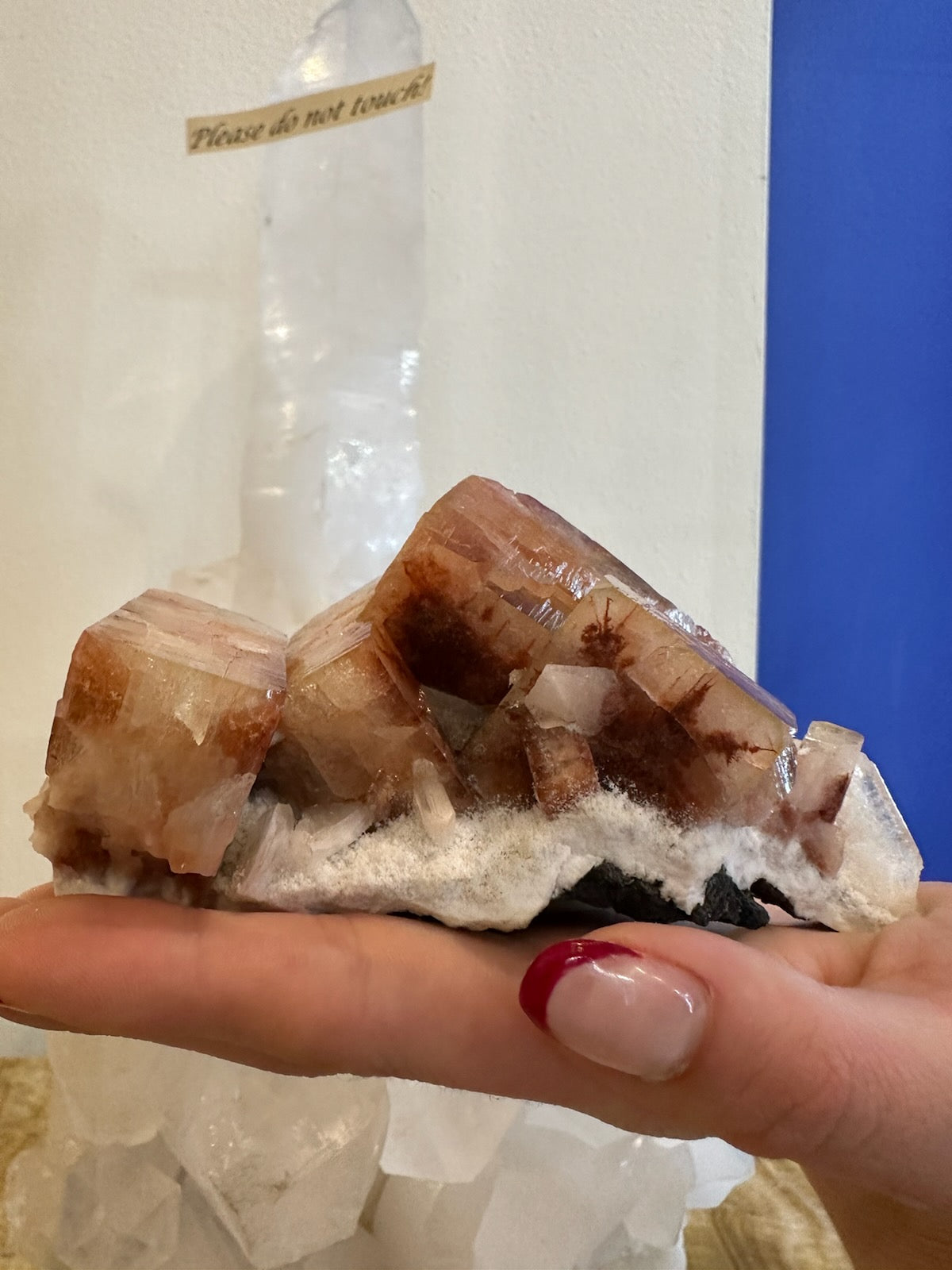 Red apophyllite cube with stilbite crystals on matrix from Pune, India, shown from multiple angles