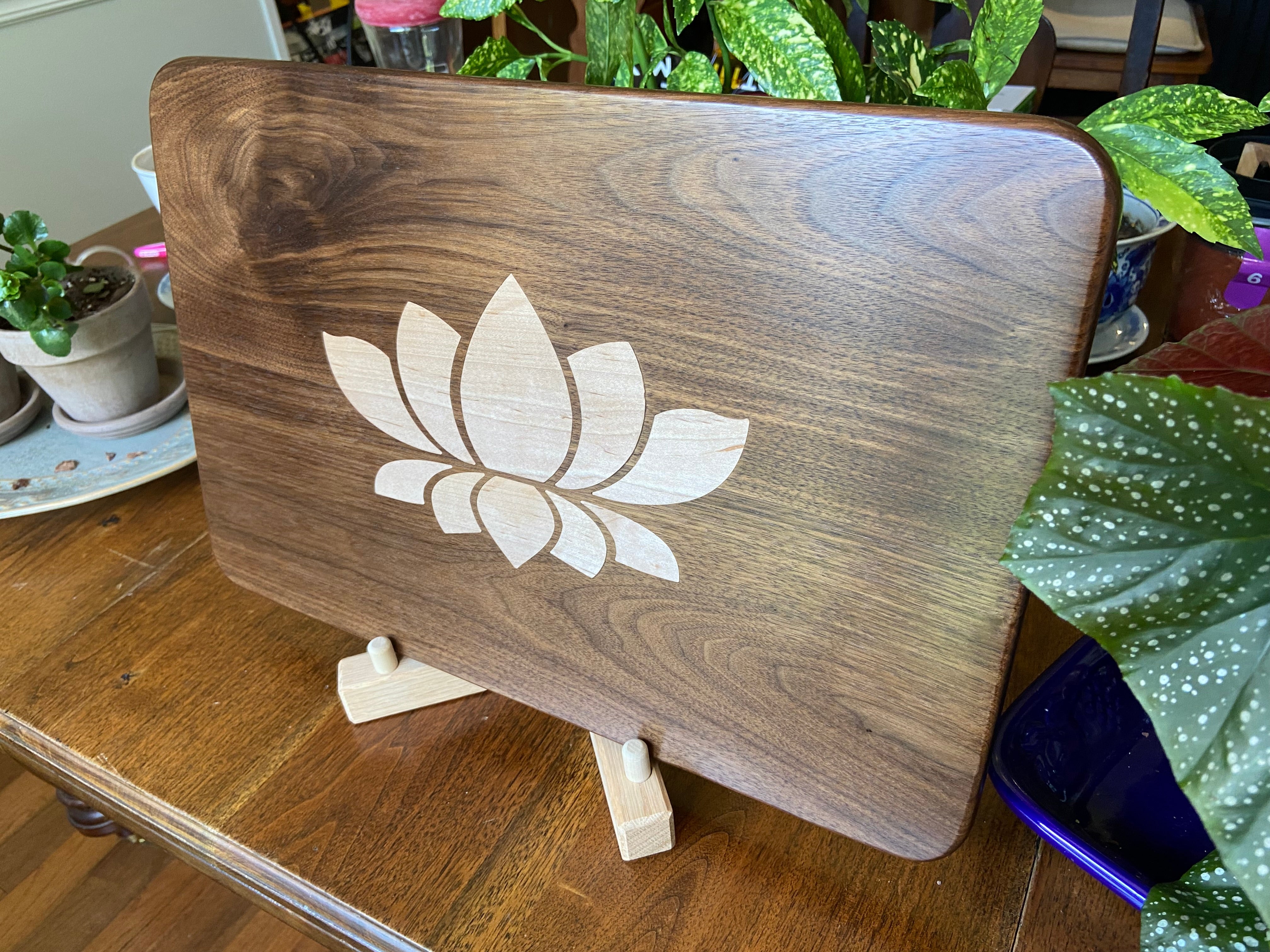 Walnut charcuterie board with lotus flower inlay made from soft maple wood