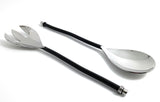 Pair of salad serving utensils with twisted black handles and shiny silver finish, featuring a slotted fork and solid spoon, displayed on a white background.