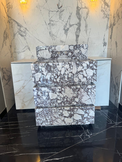 Handcrafted Calacatta Viola marble vanity freestanding showing polished surface and elegant veining