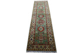 Long Afghani Kazak wool rug in blue-green with geometric medallions and beige border featuring diamond motifs, shown flat with fringes at one end.