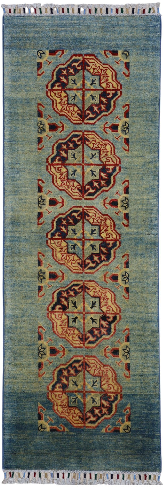 Hand-knotted Afghani Kazak wool rug in low green tones with geometric patterns displayed in natural light.