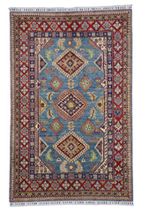 Hand-knotted Afghani Kazak wool rug in blue, cream, and red tones laid flat