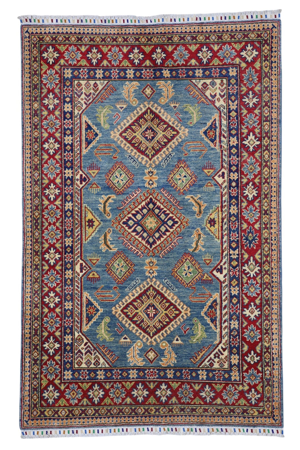 Hand-knotted Afghani Kazak wool rug in blue, cream, and red tones laid flat