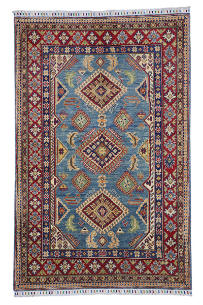 Hand-knotted Afghani Kazak wool rug in blue, cream, and red tones laid flat