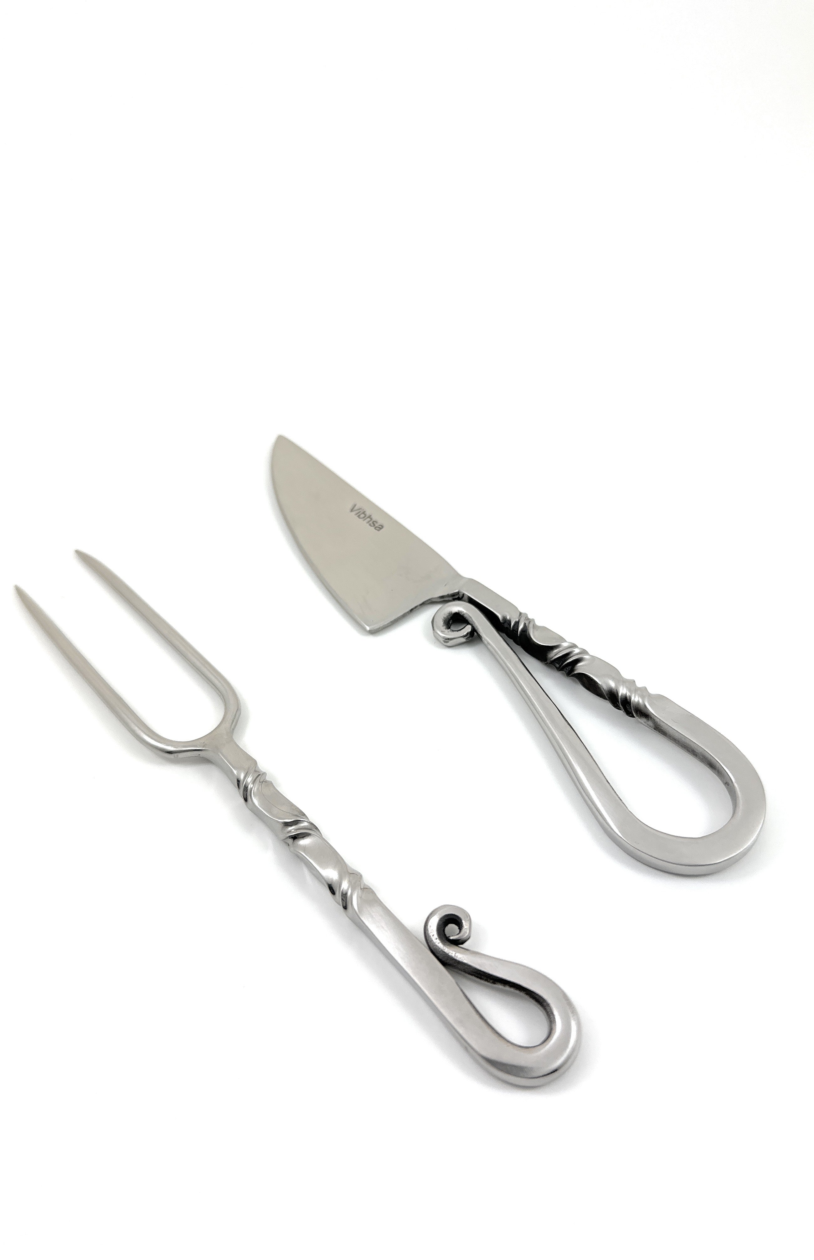Designer Stainless Steel Carving Knife and Fork set displayed on a wooden surface