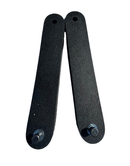 Pair of black ballistic rubber straps with mounting holes at one end and round-head screws attached at the other end, shown against a black background.