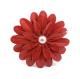 Red floral napkin ring with layered petals and a central pearl-like bead, shown against a white background