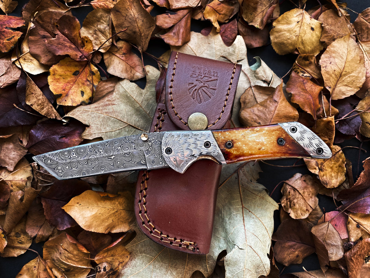Titan American Eagle Raindrop Damascus folding blade with Torched Bone handle and Eagle engraved steel bolster
