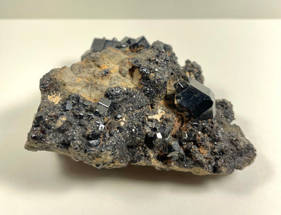 Melanite Garnet cluster on matrix with dark garnet crystals from Mali, shown in close-up
