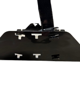 Black metal shooting target base with multiple T-shaped cutouts and a vertical support extending from the center, displayed on a black background.