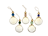 Five white scallop shell ornaments with gold edges, each topped with a gold bead and a colored round bead in blue, green, pink, teal, and cobalt, hanging from twine loops.