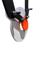 Close-up of a 10-inch bullseye gong with a bright orange circular striker mounted on a white circular metal plate with black metal arms and bolts.
