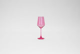 A stemless wine glass in bright bubblegum pink with a smooth, glossy finish, centered against a plain white background.