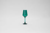 Tall emerald green stemless wine glass with a tapered bowl and thin elongated base, shown against a plain light gray background.