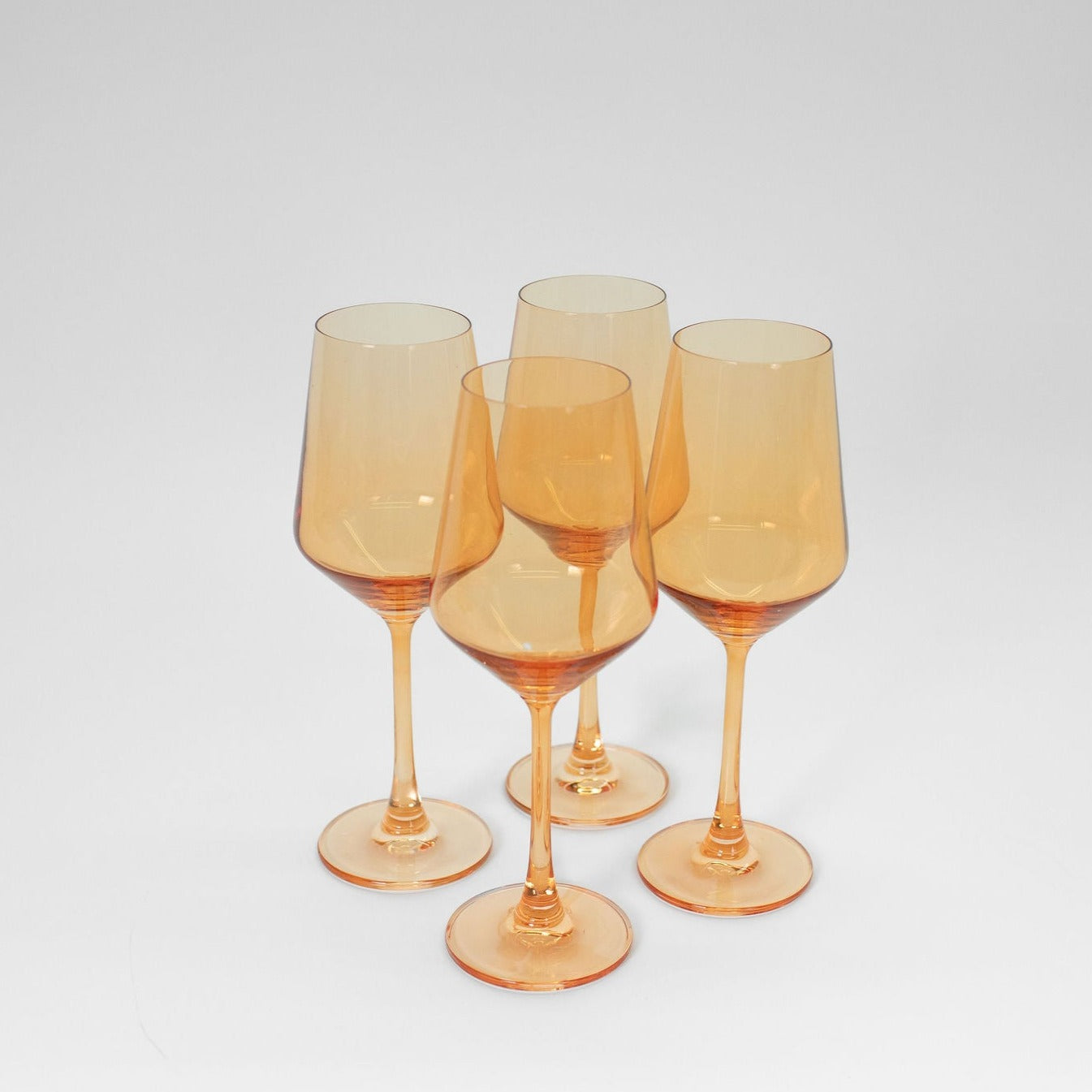 Creamsicle soft orange colored wine glass from GlassHauseCo