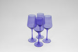Four translucent purple stemmed wine glasses with a smooth surface, displayed on a white background in a close cluster.