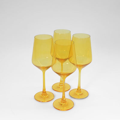 Sunshine Yellow Stemless Wine Glass surrounded by fresh lemon slices and autumnal decor
